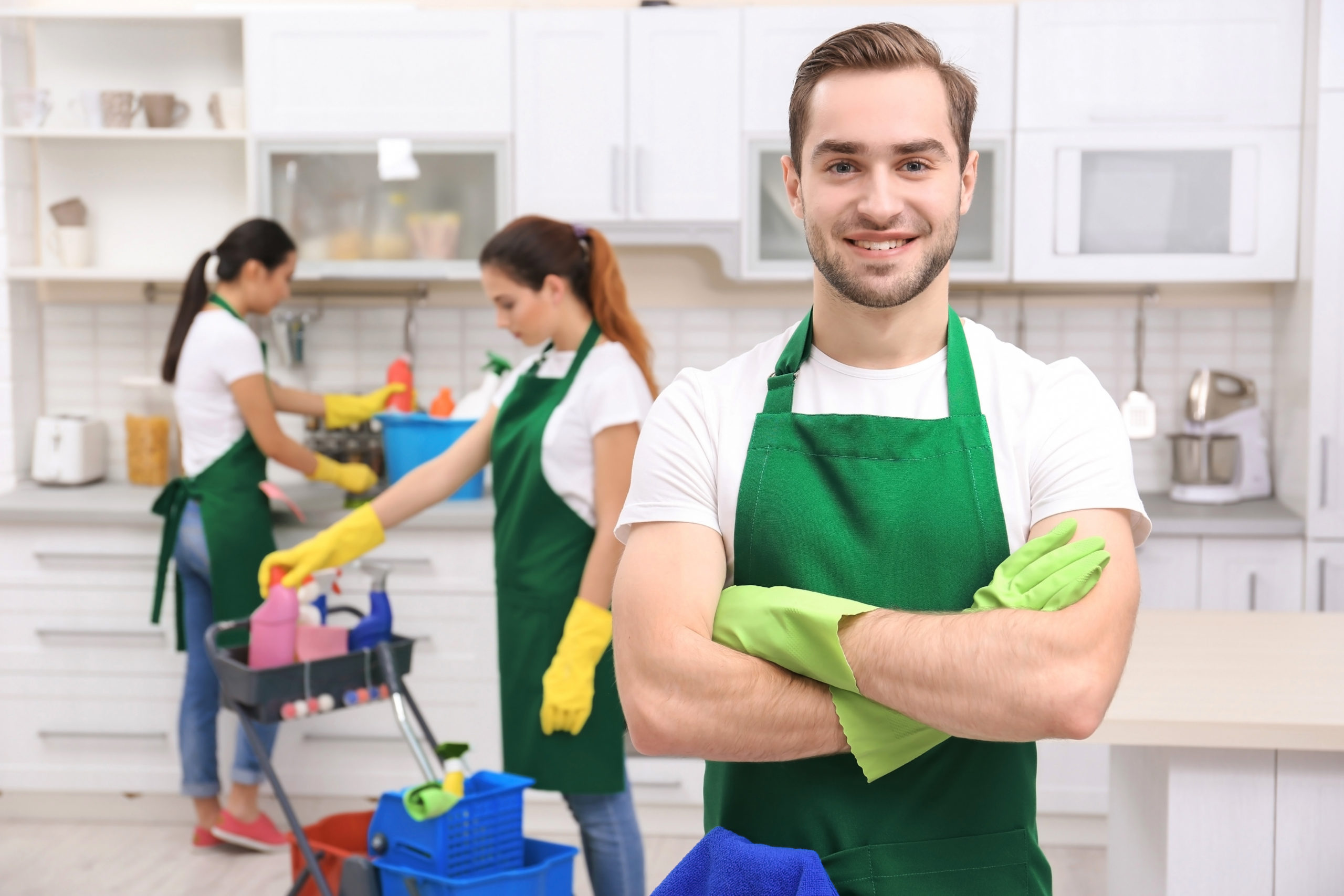 Cleaning service team at work in kitchen